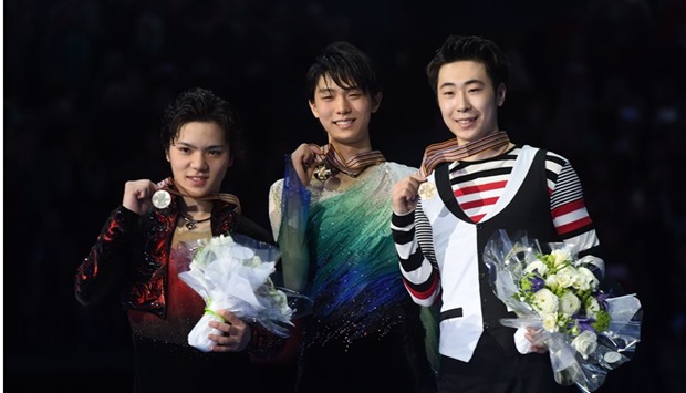 (L-R) Silver medallist Japansu2019s Shoma Uno, gold medallist Japanu2019s Yuzuru Hanyu and bronze medallist Boyan Jin of China pose after the menu2019s free skating event at the ISU World Figure Skating Championships 2017 in Helsinki yesterday. (AFP)