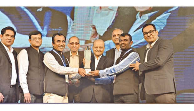 Mannai Automotive Heavy Equipment Groupu2019s Sivasubramaniam and Kumara receiving the award from VECVu2019s Vinod Aggarwal, J P Verma, and Kaushik Bhattacharya as other officials look on.