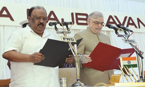 Kerala Governor P Sathasivam administers the oath of office to Thomas Chandy at the Raj Bhavan in Thiruvananthapuram yesterday.