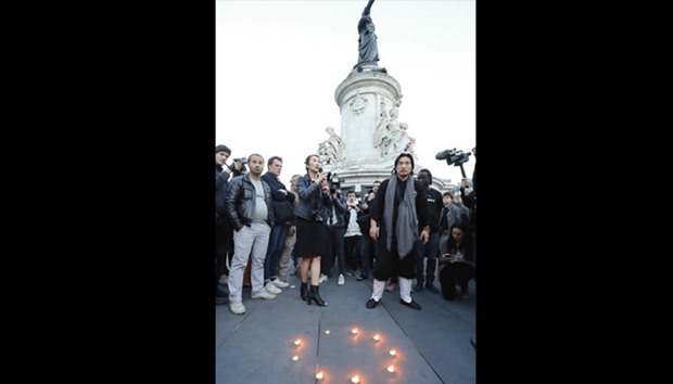 A woman speaks during a demonstration for justice at the Place de la Republique (Republicu2019s Square) on Thursday following the death of Liu Shaoyo during a police intervention.