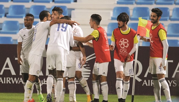 Al Khor players celebrate Mouchine Iajouru2019s goal during their Qatar Stars League match against Al Wakrah  yesterday.