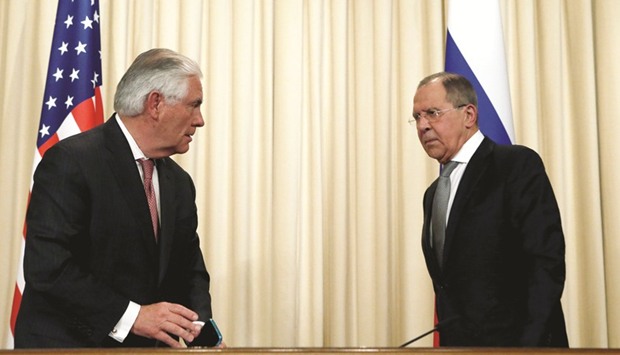 Russian Foreign Minister Sergei Lavrov and US Secretary of State Rex Tillerson stand up to leave after a news conference following their talks in Moscow, yesterday.