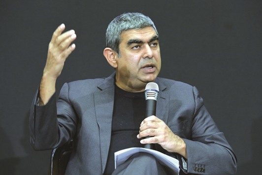 Chief executive officer of Infosys Technologies Vishal Sikka gestures as he announces the fourth quarter results at the companyu2019s headquarters in Bangalore yesterday. The IT firmu2019s shares tumbled to a two-month low yesterday after forecasting sales growth that fell short of estimates.
