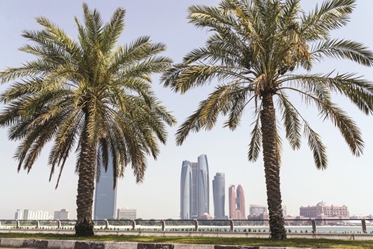 Skyscrapers stand on the city skyline in Abu Dhabi. The property market has been under pressure for more than a year after Abu Dhabi had to cut government spending and lay off thousands of workers at state-linked firms partly because of lower oil revenues.