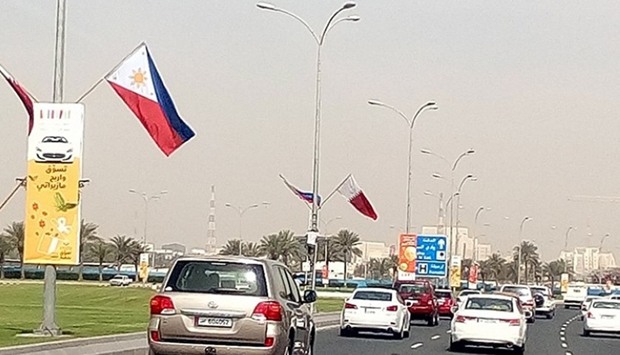 Philippine and Qatari flags hoisted on the Doha Corniche.