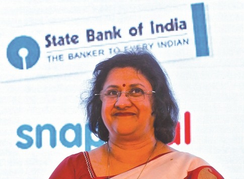 State bank of India chairperson Arundhati Bhattacharya smiles during a product launch in Mumbai. Bhattacharya said she expects a boost to annual profit of as much as Rs30bn ($465mn) in three years on cost and efficiency gains from the absorption of associate banks.