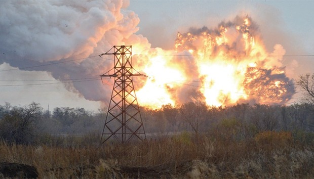 This file photo taken on October 20, 2014 shows a ball of fire following an explosion on the outskirts of eastern Ukrainian city of Donetsk. A bloodied Ukraine yesterday marked three years since it launched a campaign against Russian-backed eastern separatists that now looks like an interminable conflict whose terms are dictated by the Kremlin.
