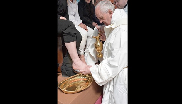 Pope Francis washing the foot of an inmate at the Paliano prison, south of Rome.