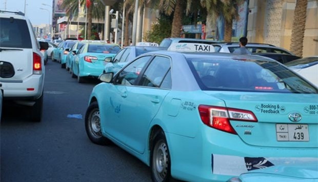 Taxis waiting outside a hypermarket in Doha Friday. PICTURE: Jayan Orma.
