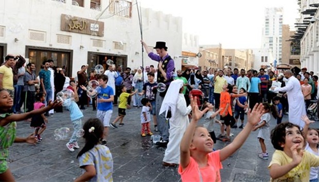 Children enjoy one of the performances of the 'world's tallest bubble man', William Wiles. PICTURES: Shaji Kayamkulam.