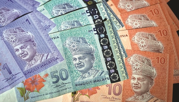 Malaysian ringgit banknotes of various denominations are arranged for a photograph in Tokyo. The ringgit has been the worst performer of 11 Asian currencies in the past six months, losing 4.6%, as the election of US President Donald Trump in November and rising US interest rates saw investors take money out of the most liquid emerging markets.