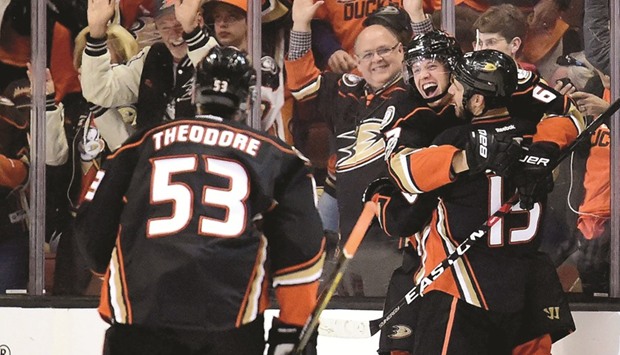 Rickard Rakell (C) of the Anaheim Ducks celebrates his goal with Ryan Getzlaf (R).