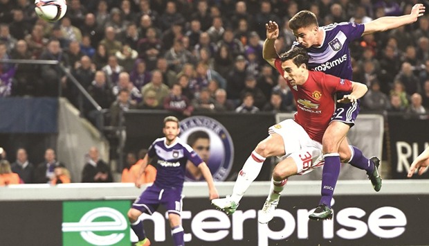 RSC Anderlechtu2019s Belgian midfielder Leander Dendoncker (R) scores past Manchester Unitedu2019s Italian defender Matteo Darmian during the Europa League first leg quarter-final.