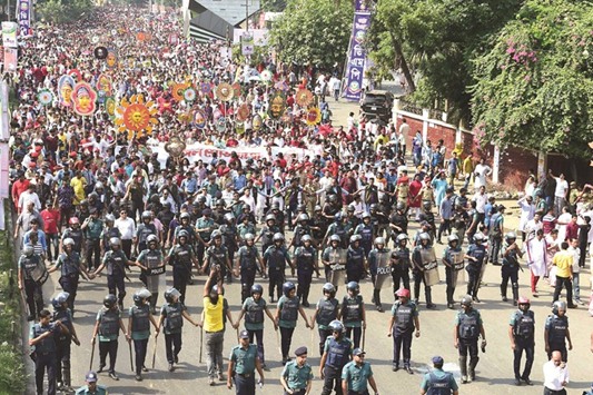Police escort a rally in celebration of the Bengali New Year or u201cPohela Boishakhu201d in Dhaka yesterday.