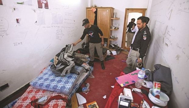 Police search the dorm room of Mashal Khan, who was killed by a mob at Abdul Wali Khan University in Mardan, yesterday