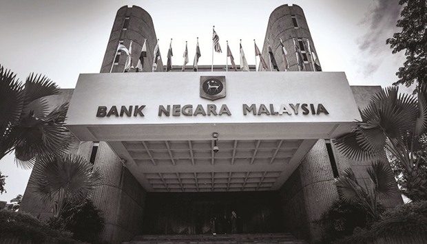 Bank Negara Malaysia is considering more strictly applying an existing policy that foreign companies owning 100% of local insurance firms must pare their stakes to no more than 70%, sources said yesterday.