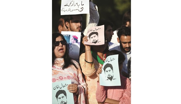 Pakistani civil society and university students shout slogans and wave placards as they protest against the killing of Mashal Khan a journalism student, in Islamabad yesterday.