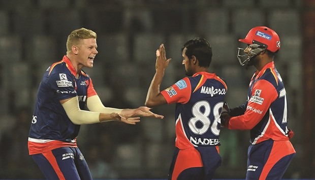 Delhi Daredevils wicket-keeper Rishab Pant (R) and Shahbaz Nadeem (C) celebrate the wicket of Kings XI Punjabu2019s Vohra with Sam Billings (L) during the IPL match in New Delhi yesterday. (AFP)