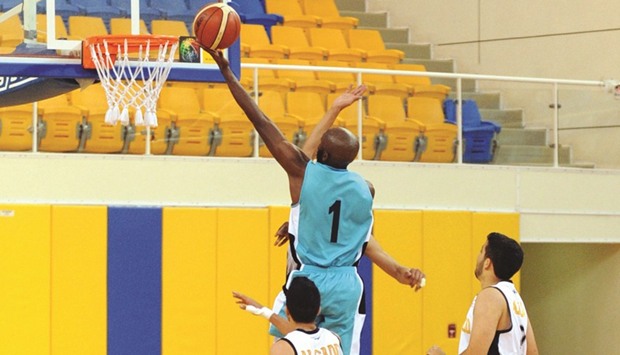 Al Wakrahu2019s Ayeni Olatokunbo (No 1 ) in action against Al Sadd during their Emir Cup basketball match yesterday. (R) In other match of the day El Jaishu2019s Leon Macklin (No 22) goes for the basket against Al Rayyan. PICTURES: Shemeer Rasheed