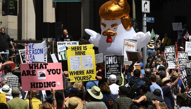 Protestors take part in the ,Tax March, calling on US President Donald Trump to release his tax records in Los Angeles