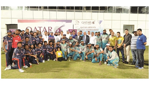 Qatar Cricket Association president Yousef al-Kuwari and other officials with the Feroz Youngsters and Galfar Al Misnad players after the two teams played out a tie in the Qatar Airways Cricket Tournament final.