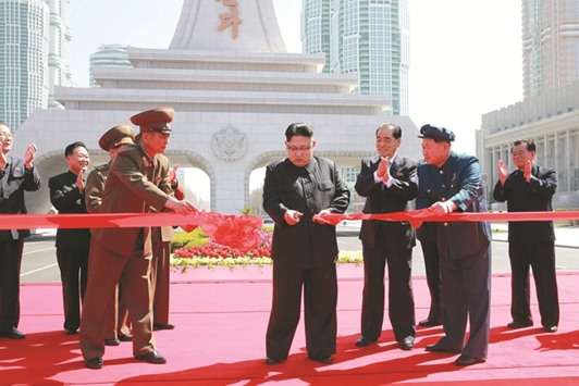 North Koreau2019s leader Kim Jong-un cuts a ribbon during a ceremony in Pyongyang yesterday.