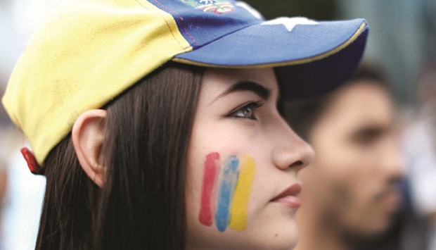 Opposition supporters attend a gathering against Venezuelau2019s President Nicolas Madurou2019s government in Caracas.