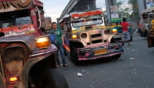 Jeepneys wait for passengers in Manila.