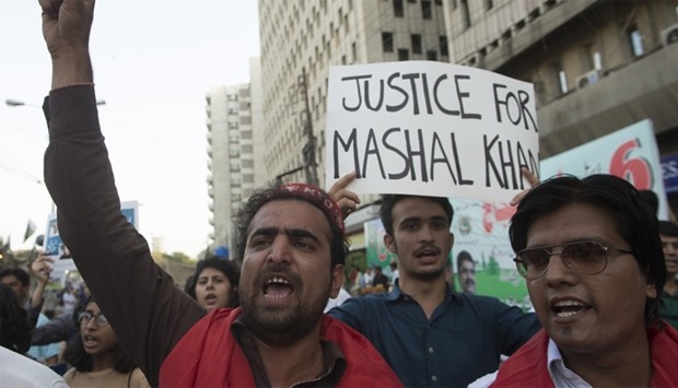 Pakistani activists shout slogans  against the killing of student Mashal Khan