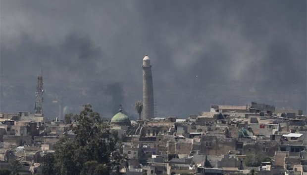 Smoke rises above Al-Nuri mosque in Mosul on Monday as Iraqi forces fight Islamic State militants.