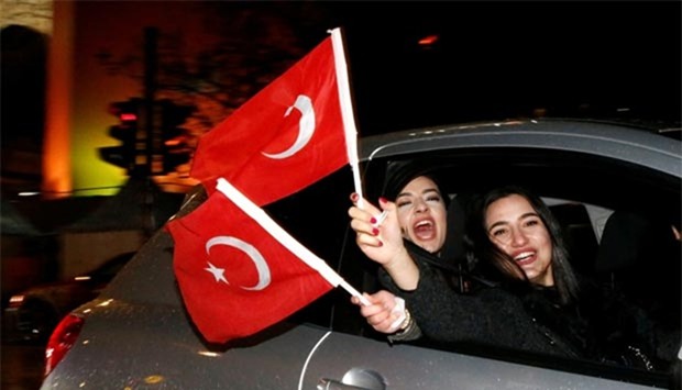 The Turkish community in Germany celebrates President Erdogan's victory in referendum, in Berlin on Sunday.