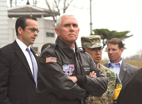 US Vice President Mike Pence (centre) visits the truce village of Panmunjom in the Demilitarised Zone (DMZ) on the border between North and South Korea yesterday.