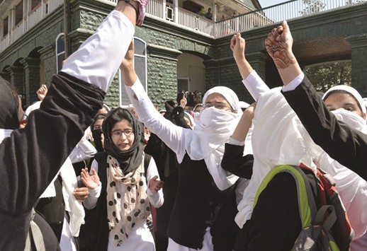 Kashmiri college students shout pro-freedom slogans during a protest inside a college in central Srinagaru2019s Lal Chowk yesterday.