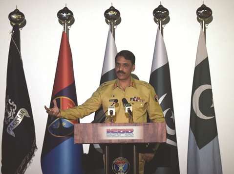 Pakistanu2019s army spokesman Major General Asif Ghafoor speaks with media representatives as he gives details of a captured would-be female suicide bomber Noreen Leghari during a press conference in Rawalpindi yesterday.