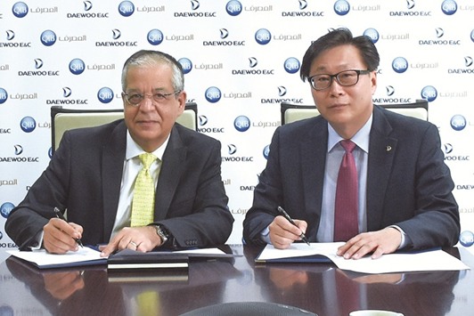 Fawzi and Cho during the agreement signing.