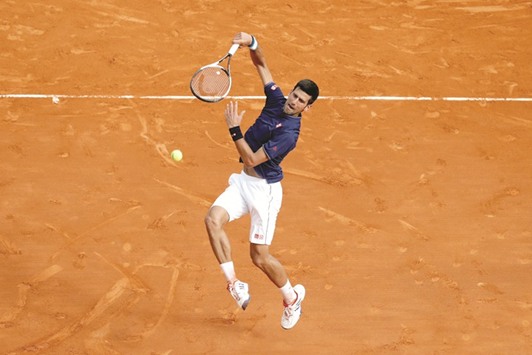 Novak Djokovic of Serbia plays a shot against Gilles Simon of France during their Monte Carlo Masters second round match yesterday. (Reuters)