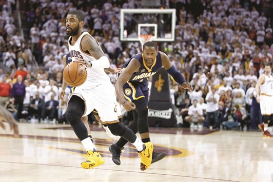 Kyrie Irving (left) of the Cleveland Cavaliers drives past CJ Miles of the Indiana Pacers during Game Two of the Eastern Conference quarter-finals during the 2017 NBA Playoffs in Cleveland, Ohio, on Monday. (AFP)