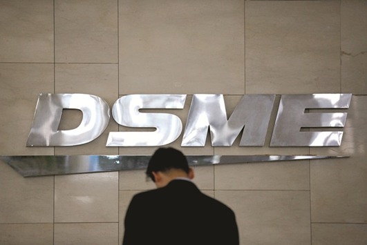 The logo of Daewoo Shipbuilding & Marine Engineering is seen at its building in Seoul. The shipbuilder won approval from over 96% of bondholders to swap their debt for equity at two meetings yesterday and three on Monday, with attendance exceeding 78%.