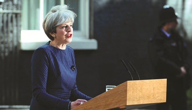 British Prime Minister Theresa May speaks to the media outside 10 Downing Street in central London yesterday. May called for an early general election on June 8 in a surprise announcement as Britain prepares for delicate negotiations on leaving the European Union