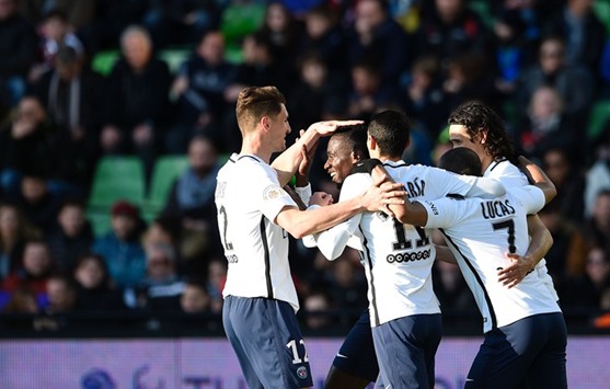 PSG French midfielder Blaise Matuidi (2nd-L) and his teammates celebrate after scoring a goal against Metz yesterday.