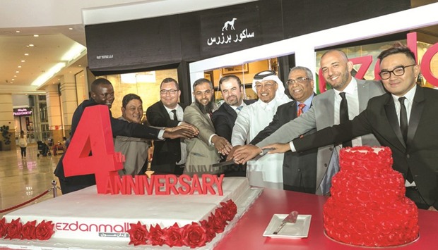 Officials and dignitaries at the cake-cutting ceremony.