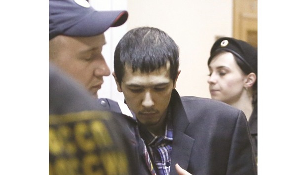 Azimov being escorted inside the court building in Moscow.