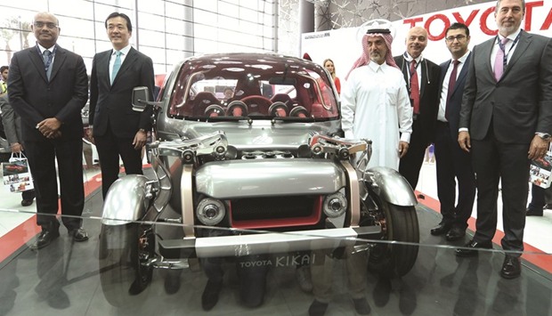 AAB chairman Dr Nasser Abdulghani and other senior executives pose with the Toyota Kikai concept car at Qatar Motor Show yesterday. PICTURE: Noushad Thekkayil