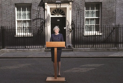Prime Minister Theresa May speaks to the media outside 10 Downing Street, in central London yesterday.