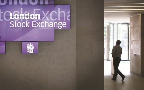 A man walks to the lifts inside the London Stock Exchange. The FTSE 100 closed down 0.5% to 7,114.36 points yesterday.