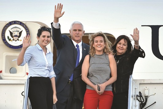 US Vice President Mike Pence (2nd from left), his wife Karen (right), and their two daughters Audrey (left) and Charlotte (2nd from right) wave as they depart Japan from the US naval air facility in Atsugi, Kanagawa prefecture yesterday. Addressing dozens of Japanese and US business executives, Pence described his country as u201cgratefulu201d for Japanese investment and stressed the vibrant business ties between the worldu2019s number one and number three economies.