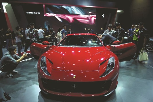 A Ferrari 488 GTB on display during the first day of the 17th Shanghai International Automobile Industry Exhibition yesterday. Global car manufacturers unveiled new SUVs, electric vehicles, and futuristic concept cars at the auto show seeking an edge as the worldu2019s biggest auto market stalls.