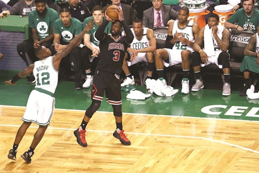 Dwyane Wade (left) of the Chicago Bulls takes a shot against Terry Rozier of the Boston Celtics during the fourth quarter of Game Two of the Eastern Conference quarter-finals in Boston, Massachusetts, on Tuesday. (AFP)