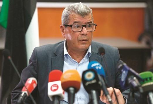Palestinian Authority official Issa Qaraqe gives a press conference in the West Bank city of Ramallah yesterday.