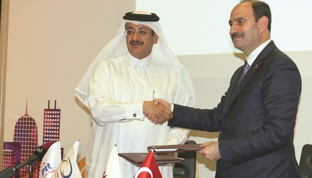 The agreement was signed by Q-Post chairman and managing director Faleh al-Naemi and Turkish Post chairman and director-general Kenan Bozgeyik. PICTURE: Nasar T K